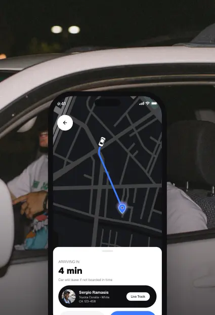 Live trip tracking on the Link app, shown over a photo of riders in a car at night